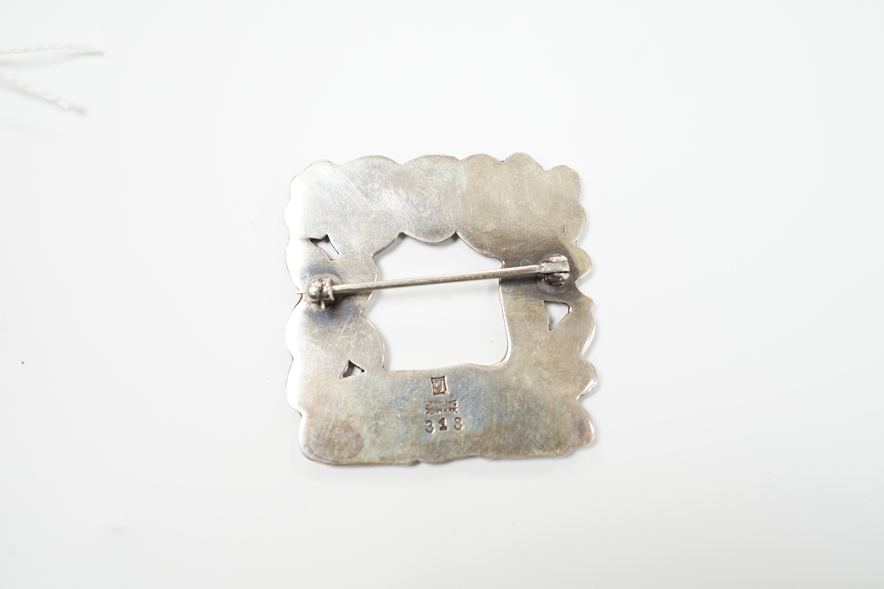 A Georg Jensen sterling kneeling deer and squirrel square brooch, design no. 318, 38mm.